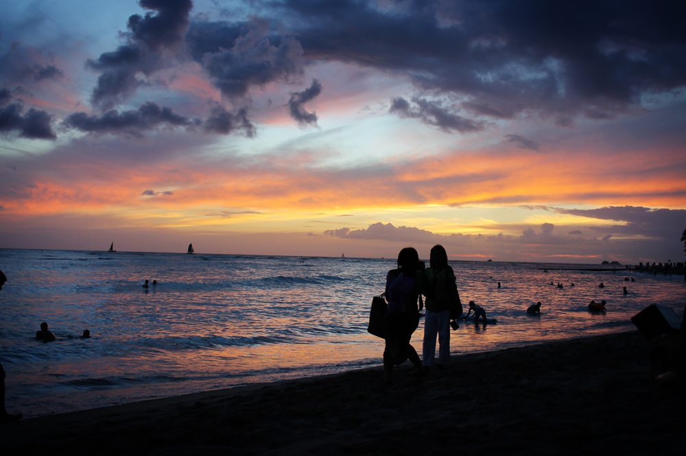 Taking in Waikiki's sunset in Hawaii on the eve of flying to Sydney for the first time