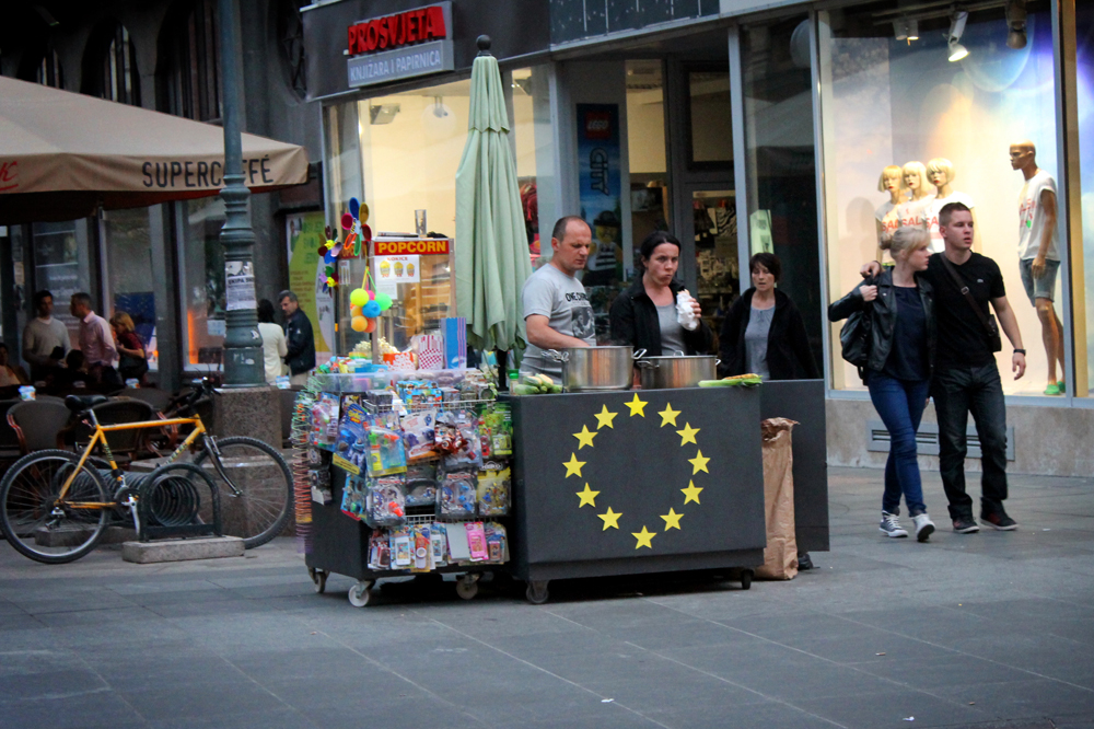 A street vendor selling corn on the cob getting in on the excitement